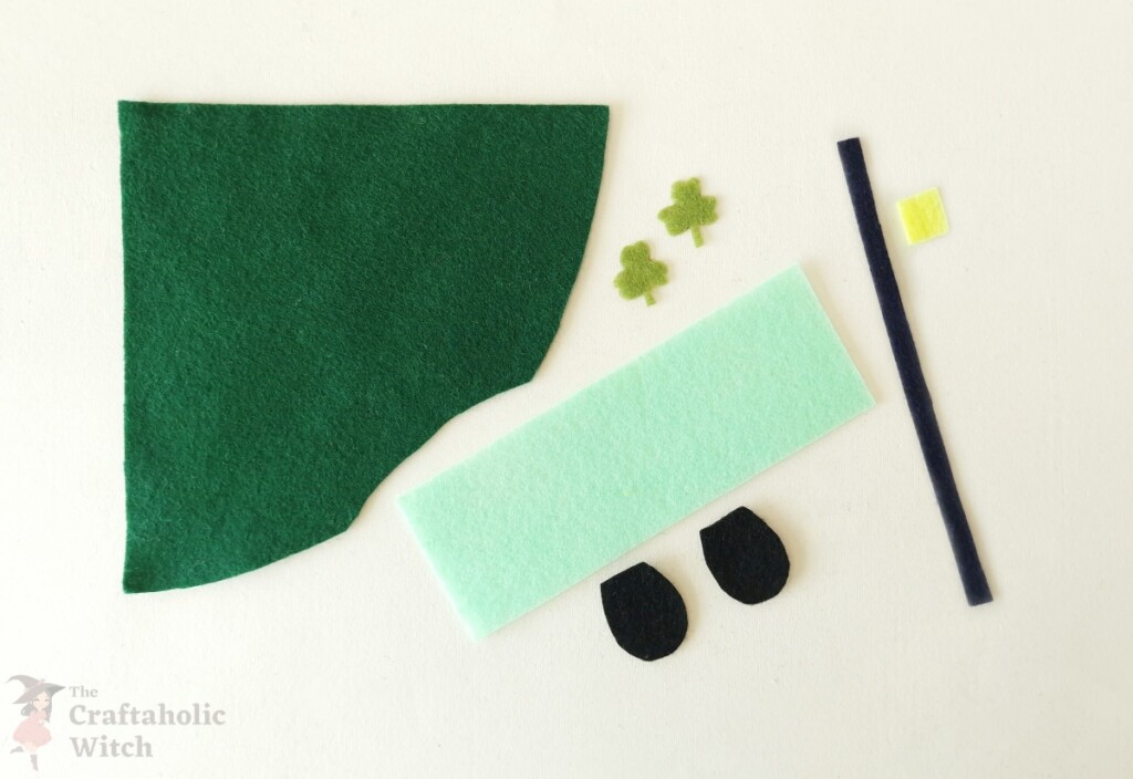 Easy Toilet Paper Roll Gnome for St. Patrick’s Day (Free Pattern + Video) 3 Cut-out felt pieces for making a DIY toilet paper roll gnome craft for St. Patrick’s Day