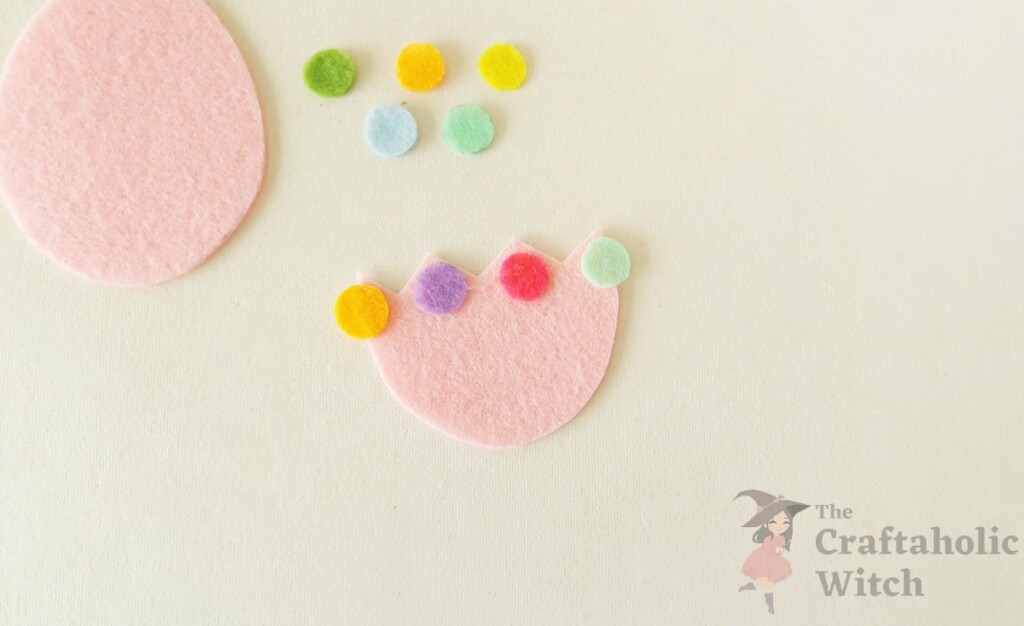 How to Make a Felt Easter Egg Pouch (With Free Template) 4 Decorated cracked top part of felt Easter egg pouch with colorful felt dots