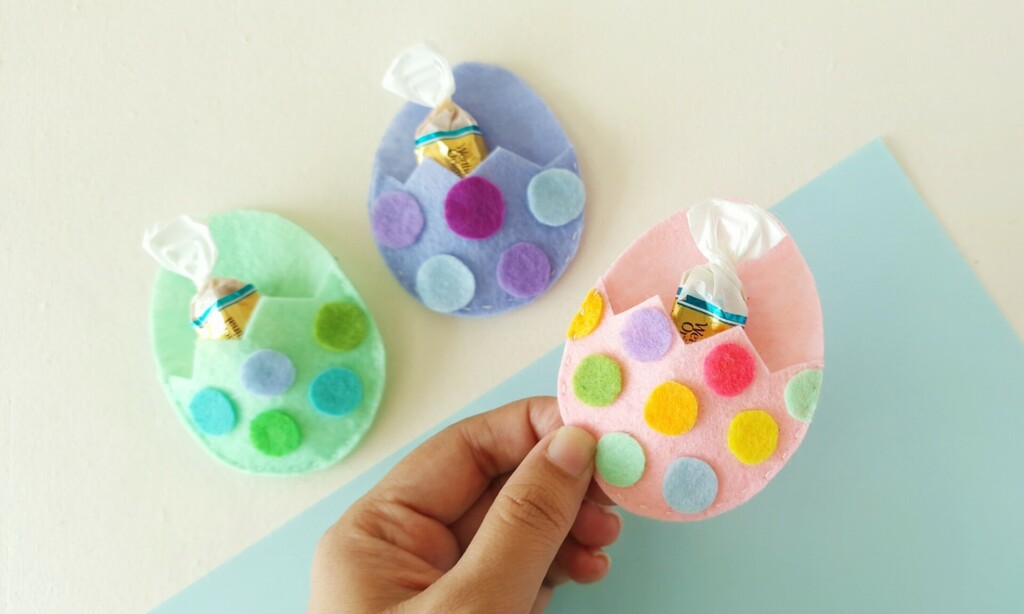 How to Make a Felt Easter Egg Pouch (With Free Template) 1 Handmade felt Easter egg pouches with colorful polka dots, used as treat holders