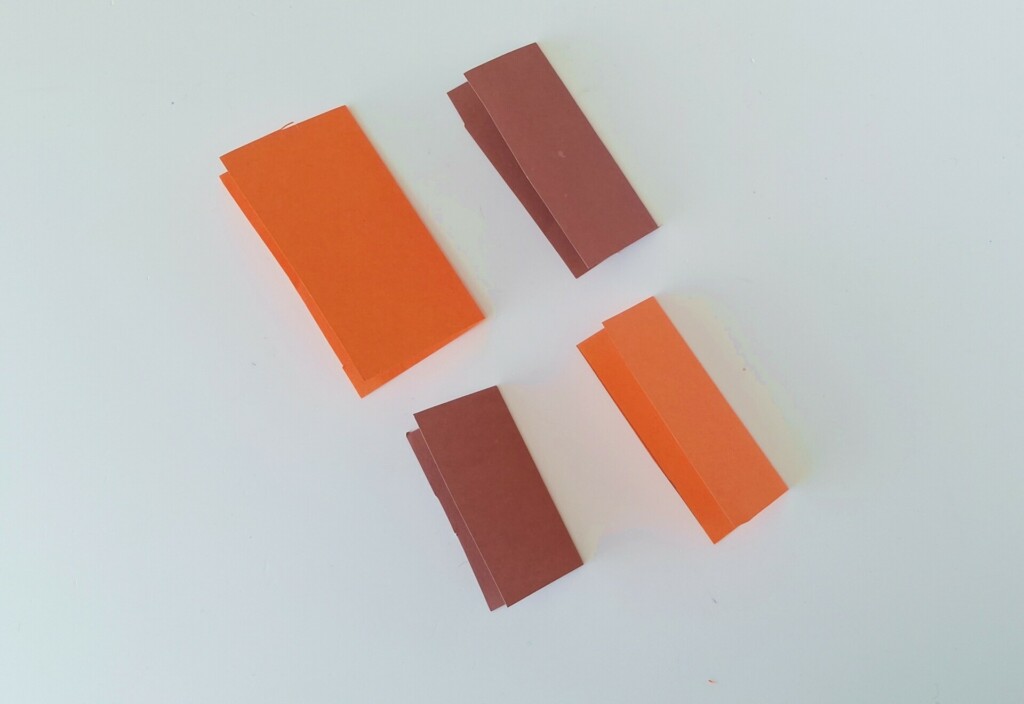 How to Make a Fall Paper Leaf Wreath (+ Free Template) 4 Step 2: Fold the Paper Cutouts in Half