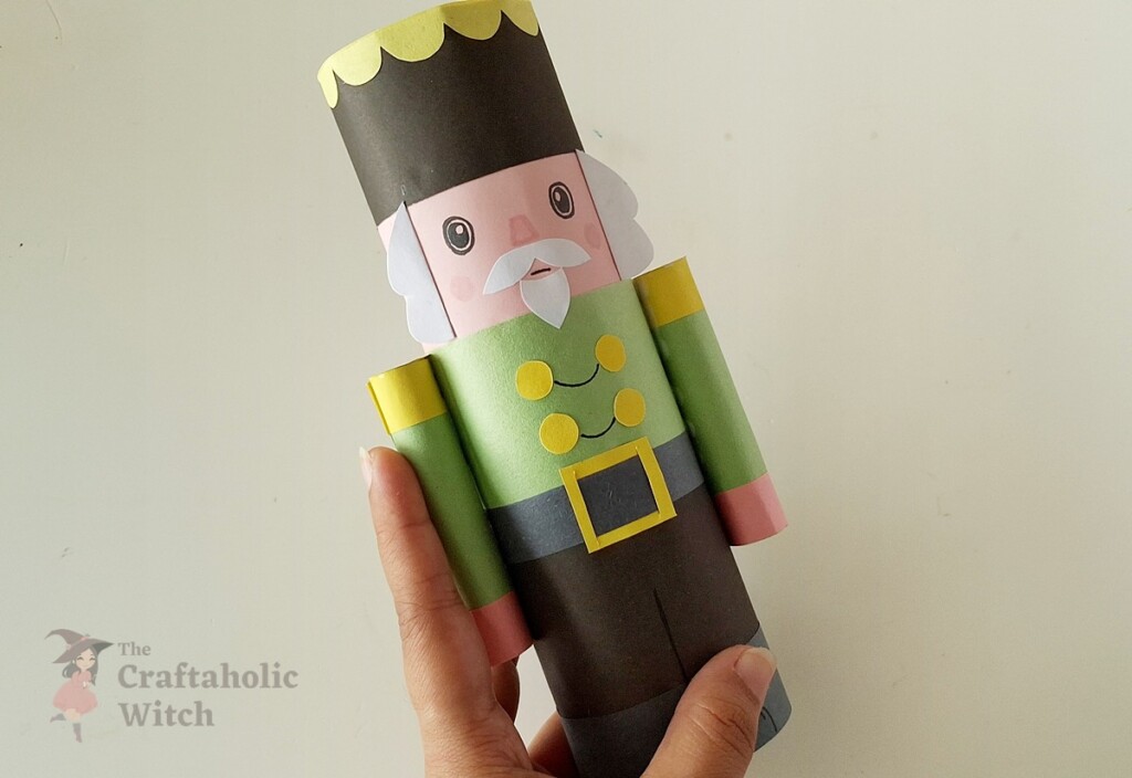 How to Make a Paper Nutcracker Doll (Free Template + Video Tutorial) 16 Step 15: Glue Arms to Both Sides of the Body